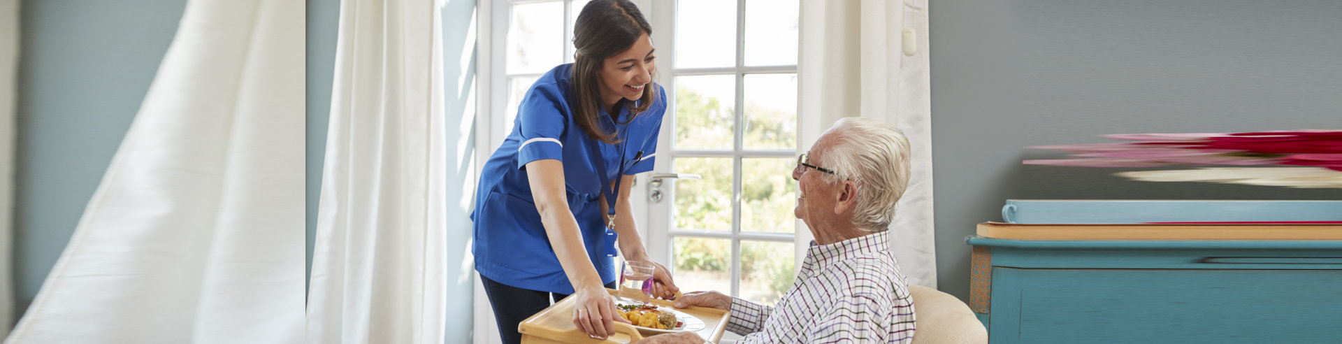 medical staff assisting elder man